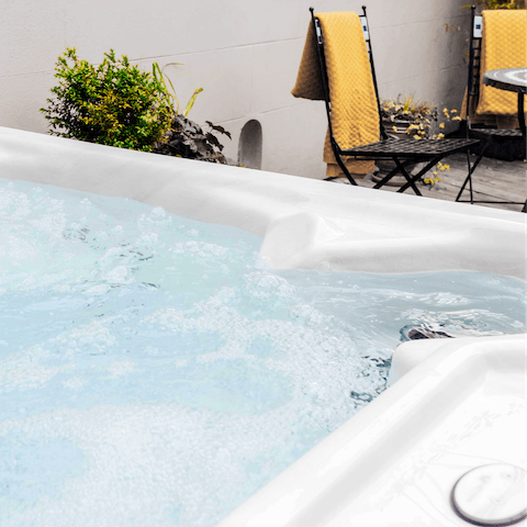 Unwind in the hot tub after a day out in the Somerset countryside 