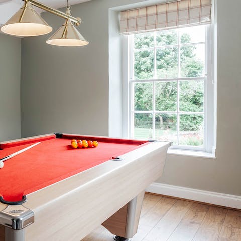 Gather the group together for a game of pool in the games room