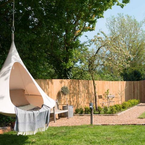 Curl up in the hanging cocoon chair with a good book