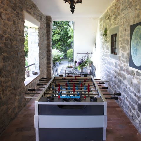 Challenge your friends to a game of table football 