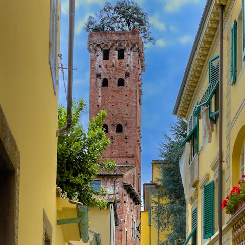 Take the short drive to the town of Lucca and wander its ancient streets 