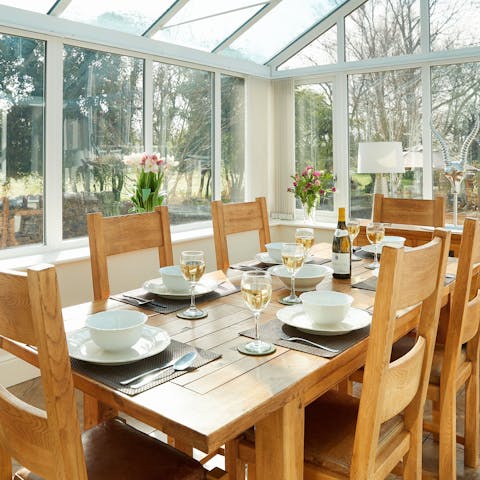 Sit down for a celebratory meal in the conservatory 
