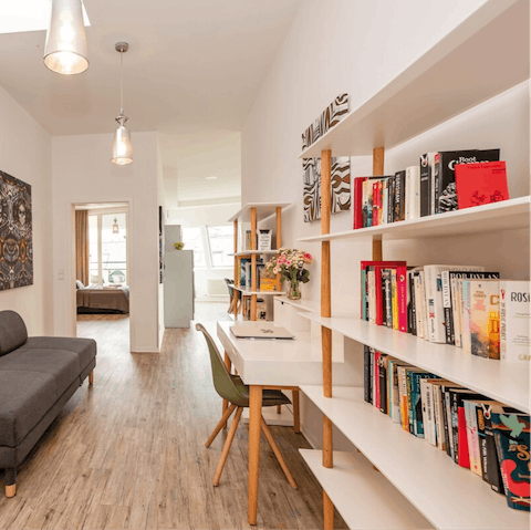 Pick your next read from the well stocked bookshelves in the study