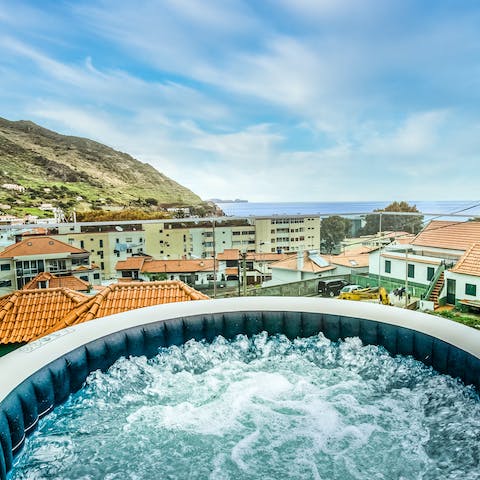 Ease yourself into the bubbling Jacuzzi at the end of the day