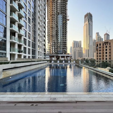 Go for a swim at the on-site pool with city skyline views