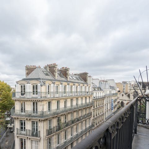 Enjoy your morning coffee on the balcony with beautiful rooftop views