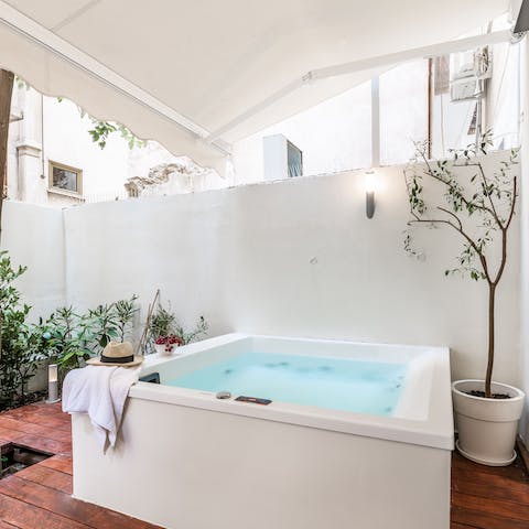 Slip into the private Jacuzzi on the terrace for a post-sightseeing soak