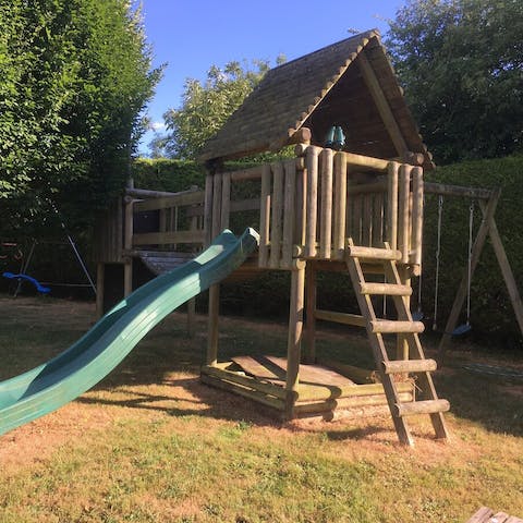 Watch the kids potter around in the play area and bounce on the trampoline
