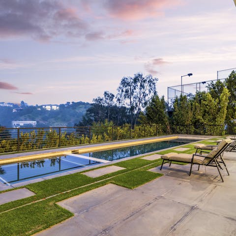 Enjoy beautiful canyon views while relaxing by the pool