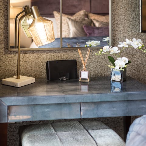 Work from home at one of the designated desk spaces