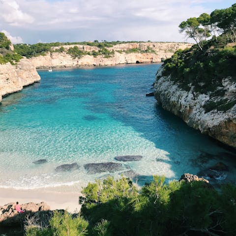 Spend time relaxing on the sandy beach in Puerto Pollensa, a ten-minute walk away