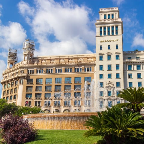 Stroll around the Plaça de Catalunya, a short walk away