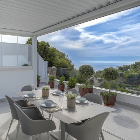 Admire sea and mountain views as you dine alfresco