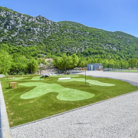 Teach the kids how to play golf on the private putting green