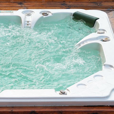Sink into the outdoor hot tub for a long, luxurious soak
