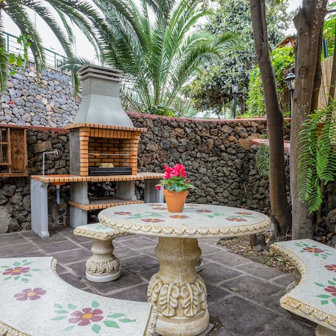 Grill up a family feast in and amongst the palms