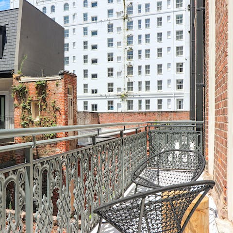 Enjoy a glass of wine on the balcony 