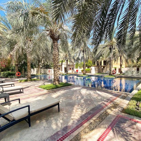 Spend dreamy days relaxing by the pool, watching the palm trees sway, and taking dips to cool off