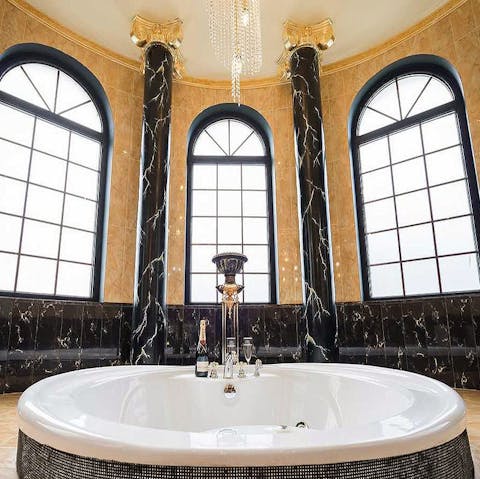 Take bathing to the next level in the main suite's grand tub