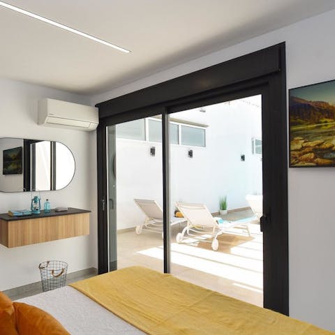 Be out in the sun in seconds with the main bedroom's French doors