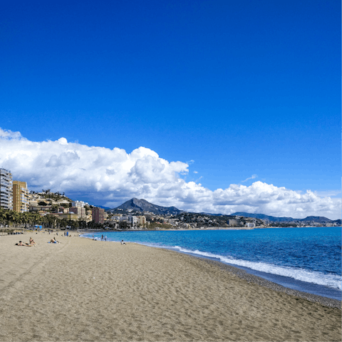 Feel the golden sand between your toes at Malagueta beach