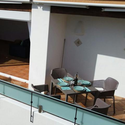 Set up for a meal in the evening sun on the private balcony