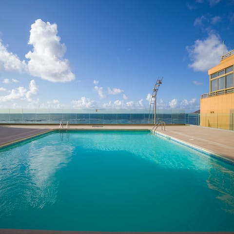 Go for an early morning dip in the communal pool and admire the ocean views