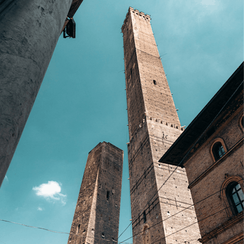 Gaze up at the Two Towers, Asinelli and Garisenda, a ten-minute walk away