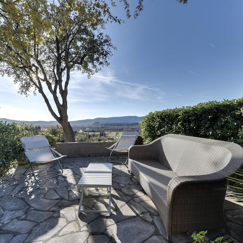 Relax on the outdoor sofa while taking in stunning countryside views