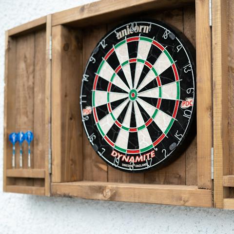 Unleash your competitive side with a game of darts, outdoor Jenga or ping pong
