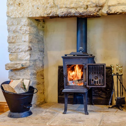 Get cosy around the wood burning stove on chilly evenings
