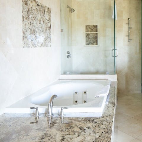 Unwind with a soak in the master bathtub – you can even spot the ocean out the window