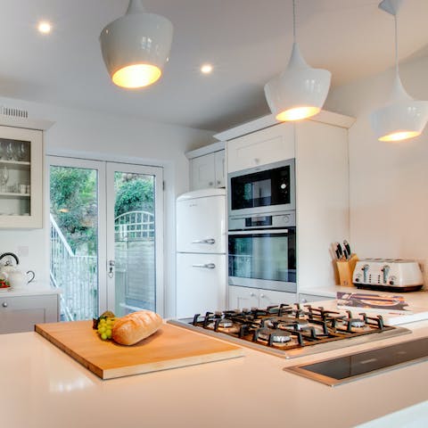 Cook up a storm in the sleek kitchen complete with a steam oven