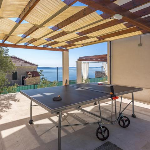 Take solace from the mid-day sun with a game of table tennis beneath the shady pergola