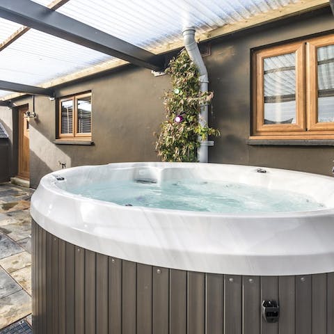 Spend evenings soaking in the covered hot tub with a drink