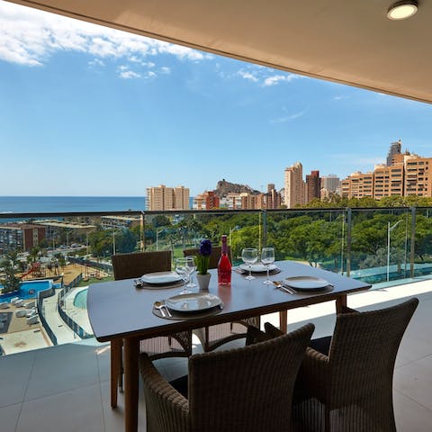 Share Spanish feasts on the balcony overlooking the sea