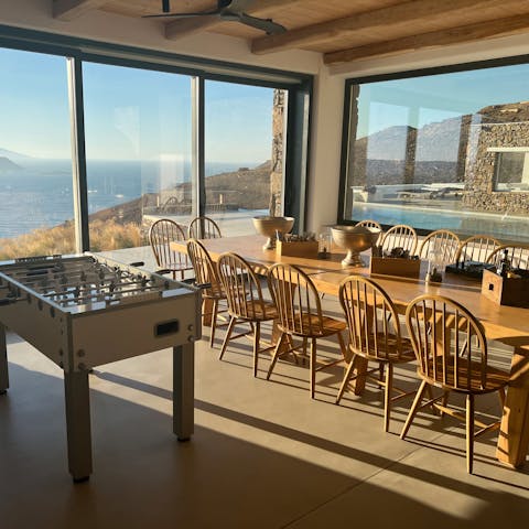 Gather for breakfast at the long dining table with a beautiful view