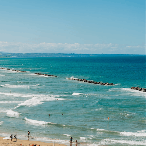 Visit Costa Merlata Beach on a scorching afternoon