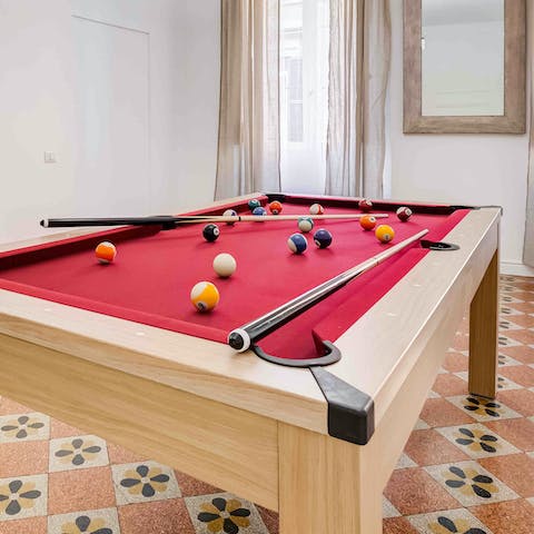Enjoy a game of pool or table tennis in the open-plan living space