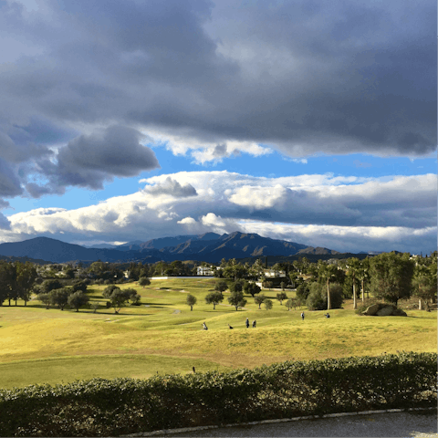 Practice your swing on the local golf courses surrounded by the Sierra Mijas Mountains