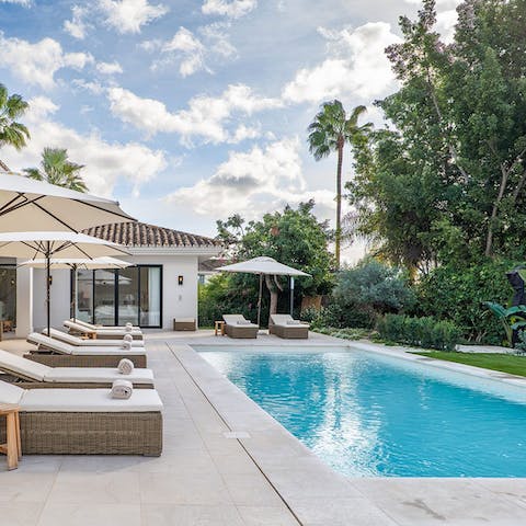 Work on that perfect tan by the private pool
