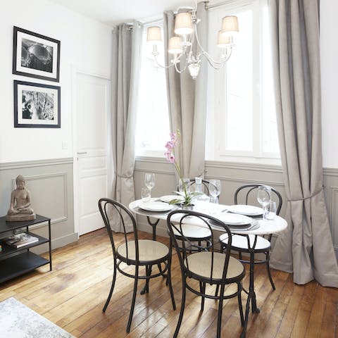 Sit down to a celebratory meal at the chic bistro-style dining table
