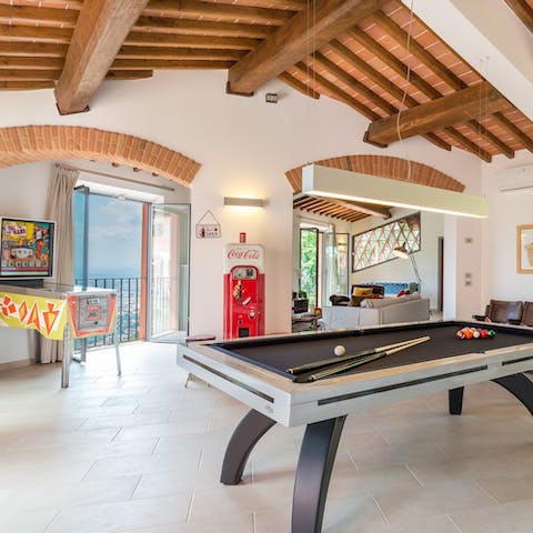 Shoot a little pool or play pinball in the bright living room