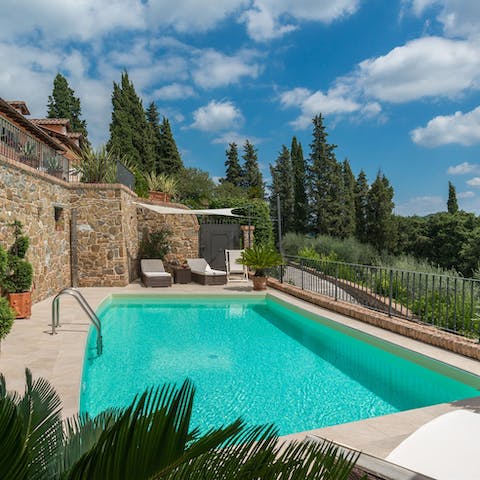 Splash about in the villa's swimming pool before dozing off on a lounger