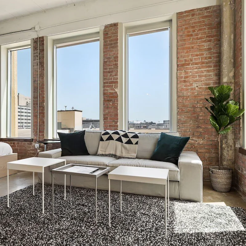 Admire the industrial chic design and huge windows looking over the city