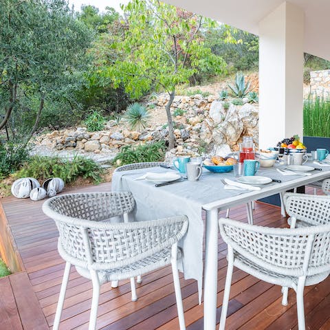 Share a home-cooked Italian meal and a bottle of wine on the terrace