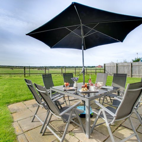 Dine alfresco while admiring the views of the Cheviot Hills