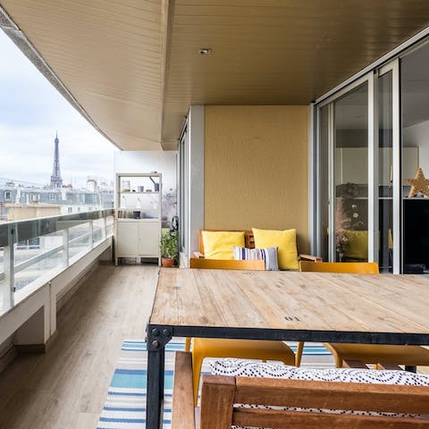 Enjoy coffee and croissants on the terrace, feasting on Eiffel Tower views