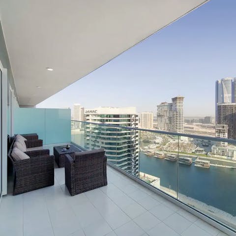 Sit out on your private balcony, overlooking the Dubai Canal