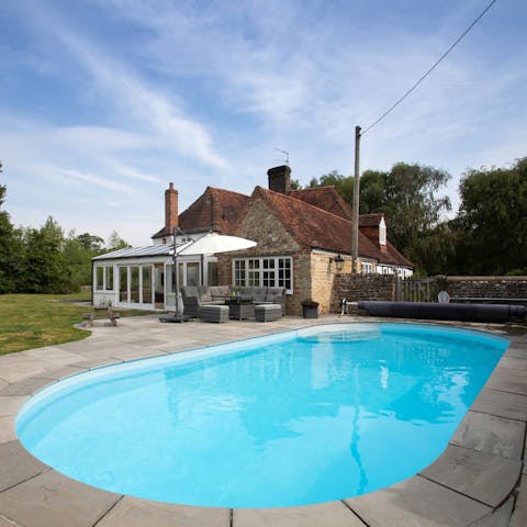 Enjoy a lazy summer's day at home and soak in the pool or hot tub